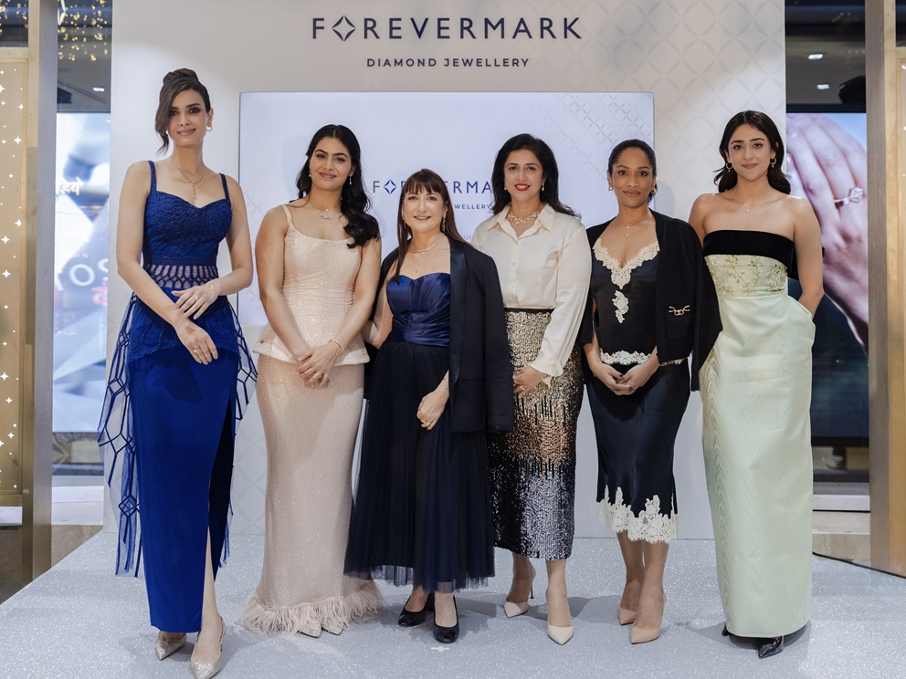 women standing against Forevermark background