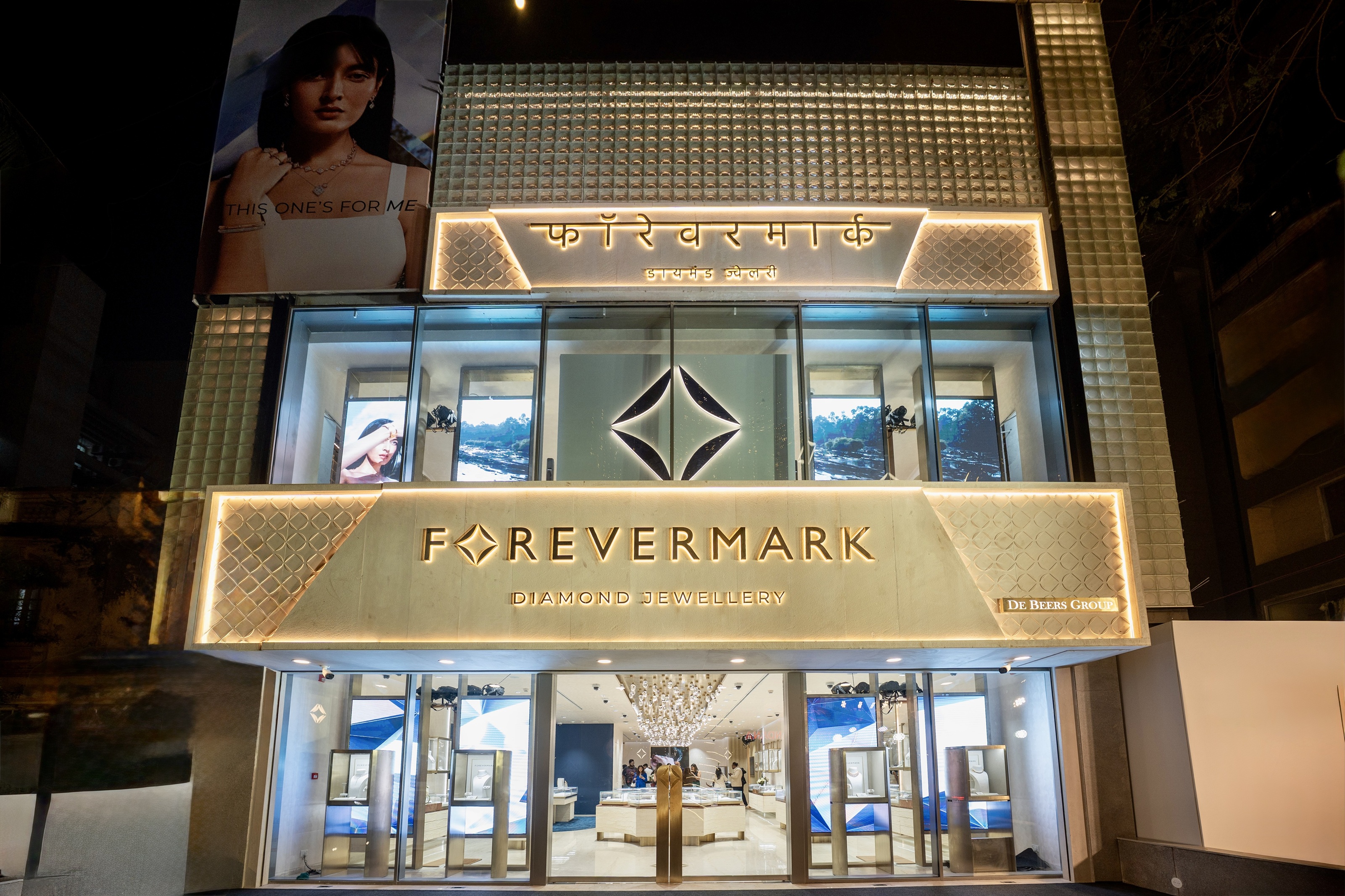women standing against Forevermark background