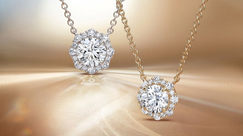 Two Forevermark diamond necklaces on gold background